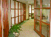 PHOTOGRAPH OF THE INTERIOR HALLWAY SHOWING THE INNER AND OUTER OFFICE RINGS BATHED IN NATURAL LIGHT.